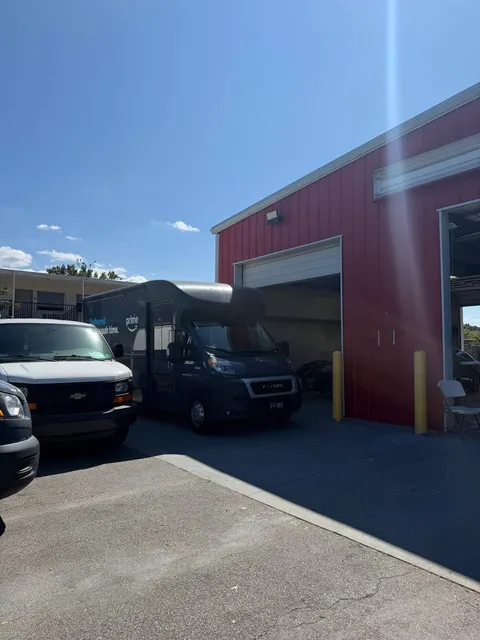The red GTS workshop building and open service bays